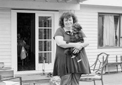 It was the noise at first. A terrible cracking sound. It was the sound of the house being broken. I remember leaping out of bed and standing in the doorway and Greg going past me to grab the kids and I’m thinking, God, that’s right I have to get the kids and I went to the little ones at this end of the house. Greg went up the stairs to find the rest of them. One of our boys couldn’t find us in the dark, it was like a disaster movie, what happens next? In a flash our own little world, along with many others, disappeared. A great deal of what you know and care about disappears. Everything that only moments before felt safe and familiar, is suddenly gone. Dismantled. Taken away from you. And you can’t… I couldn’t think about it. The government starts using these terms. You know… we are orange but we could go red. Or green. No, no, eventually we will go green. We have to. Must do. Won’t we? Then you wait, and there’s so much to deal with it’s hard to think about anything else until one night, a long time later, they announce it. We are watching it on television, on the news, and I’m thinking worst-case scenario they’ll rebuild the house. Okay, it’ll be a bit of a push, but we can live with that. That’s what I’m thinking. Everybody else could see it, but not me. It’s like I’m blind until they say the word. Red. That was the decision. They said it was red and I’m in shock. I just felt… it was like part of me had been ripped away, yeah, reached right in there and gutted me. I felt, this is what it must be like when someone dies. Everybody else’s life carries on but your own life has stopped.