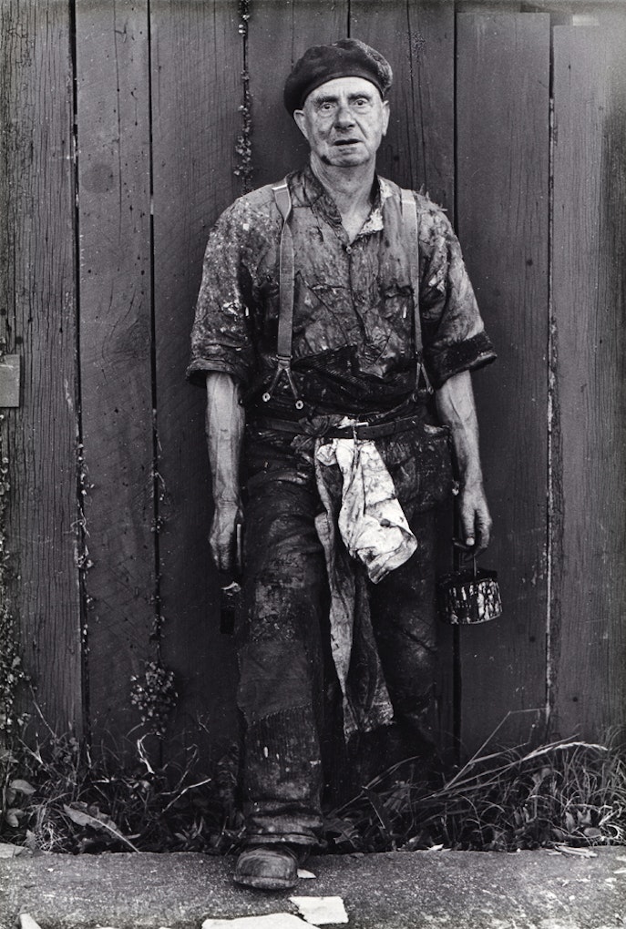 Glenn BuschMan painting his fence1973