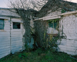 Czech immigrant and photographer Joseph Divis (b. 1885) arrived in New Zealand in 1909, finding work as a coal-miner in Blackball. He settled in Waiuta later in life, where much of his time was spent documenting the town, events and the mine. When he died in 1967 he was one of Waiuta’s last inhabitants, and his glass negative archive was discovered when his house was cleared nearly twenty years after his death.