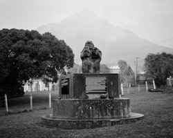 During the Taranaki war (a land dispute between Māori and colonial settlers), many Māori were removed from Parihaka, a small community in the Taranaki region, as prisoners. They were sent to numerous places in the South Island, one place being Ōtamahua (Quail Island) which is situated in the centre of Whakaraupō. The memorial outside the Whare Karakia (small church) at Rāpaki is dedicated to the people of Parihaka who perished on Ōtamahua as a result of the war. The bodies which are now buried underneath the monument consist of women, men and children.