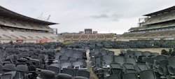 Preparatory stages of demolition. Looking South from old ticket gate across stadium chairs sold on Trade Me.