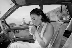 I’m in the car and it’s like a sort of freedom, I feel in control of the situation. I’m not very good at being a passenger – being a passenger is very much not being in control. Dad bought me my first car when we lived out at Rangiora and I was sixteen. The teenage years weren’t easy, so that car was my escape. That’s when it started – my life in the car. It was symbolic, I suppose, the journey into town and everything that brought into my life. I could go wherever I wanted – escape. It gave me my own life. It still does. Yes, that’s true. If I didn’t have a car now, I would certainly feel trapped. Not having to rely on others, it’s a very important part of me. At the moment I drive a lot during the day because of my job selling real estate, but come the end of the day, you know, I’ll go through my diary, I’ll organise everything –appointments, open house, whatever – then I’m in the car and it’s relaxation time. Driving somewhere, anywhere – a journey. It’s what I do. What I love. The diary gets put aside, the music goes on, the suit jacket comes off, the hair goes out, the cigarette gets lit, the windows are down and I’m gone. And it’s like . . . it’s like heaven.