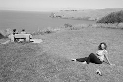 I know that for some people it’s seen as a negative place, a place where people have decided to end their lives. One of my friends did exactly that, so I know the repercussions of such a thing, the devastation in the family. Sometimes I’ve sat up here and wondered what the heck was going through their minds. I see the cigarette butts and I think, gosh, they must have been in so much pain to do that. But you see, to me Whitewash Head is a very positive place. It’s a place I choose to go to all the time. I really love it. It takes me away from the bustle of the city. There’s a sort of solitude up there, and getting some space for myself is important to me. With my job, I have targets and if I don’t meet them, my job is history. I’m on the phone a lot of the time, I’m out with people and I’ve got a daughter who doesn’t go to bed until nine thirty or ten. Having a bit of time on my own to relax is really important to me. A few years ago I was sitting up at Whitewash Head and I had a realisation of sorts. My life then just seemed to be drifting by and I very much needed to have some sort of direction. I seemed to be surrounded by people who were depressed, people who were not getting anywhere with their lives. I can remember sitting there that day and deciding that I wanted to be different. At the time I had a little girl, I was overweight and I was reliant on the government. I thought I was nothing. I had absolutely no idea what I wanted to do, but I knew I had to do something. Going to university was the first big step. First of all I did a course that helps you to write essays. I did really well, so I went along to the open day and enrolled. It was a great feeling to have a schedule, get stuck into things – to persevere. And I started to get really good marks. That gave me confidence and also it surprised other people who had always thought I wouldn’t amount to much. I realised what a bad thing all that negativity was for me, how limiting it had been. These days I make sure I surround myself with motivated, ambitious people. It made me think about my own daughter too, and how I never want to be negative to her. I think that’s one of the worst things you can do to anyone. Anyway, you can see why coming up here is special for me. It’s a very majestic sort of place with its own unique beauty – all of that – but to me it’s about feeling positive. I can come up here and just unwind and feel positive all over again. It’s a good place to dream. Yes, that’s it, a place I can come to and think about how I want my life to be.