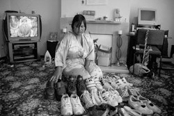 We were refugees, so the idea of home is important to us. I was actually born in Thailand. Both my parents are Cambodian, but when I was conceived my father was a soldier – there was war at that time – and my mother had to flee the country. She went to the border of Thailand, and that is where I was born. But my home is here. My mother has bought this flat we live in. We’ve had it about fifteen years now. The two other flats in our block are owned by real estate agents, but our place will always be home. My mother will always be here, and that’s important to us. We’ve made it the way we want it to be. Put up all our things that are special to us. The photos and the doll there on the wall, and my mum’s fish tank, everything there has a story behind it. Even that shoe collection of mine – I’m a bit embarrassed about it really – I have all these shoes, but mostly I just like to wear my flip-flops. I think it’s been easier for my sister and me than it has for Mum. We went to school here and learnt English – learnt Kiwi ways – but even after seventeen years Mum still doesn’t speak English that well. It’s been harder for her. Her life has been more difficult than ours. Not that she ever talks about it. I think talking about it just brings back the bad memories for her, so I don’t know much about it. I know we’ve had a good life – my sister and me – we’ve been lucky. The friends we’ve made, the people that originally helped us here. Yes, this is our home all right. Well, it’s the only place we know.