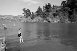 There are two parts to it. One is being brave enough to get into the water and the other is the way you feel when you come out of the water. Since I turned fifty I’ve done lots of things that I never did before. I got my driver’s licence when I was fifty-two, and it was so liberating. I went skydiving, which was something I’d always wanted to do but was afraid to do. I even got to the stage where I tried to do things that frightened me. I’d never been physically brave before, but I was discovering I could do these things. Then one day some friends said why don’t you come jetty jumping with us. When we got down there I looked at the drop – none of the other women would do it – and I thought, well, that’s enough for me, I just ran and jumped. I did it without thinking about it. After that I knew I could do it. You jump and the water closes over your head. You go down and it is a kind of release. That’s the effect it has on you – on me. I just love it. Summer and winter, even when it’s freezing I jump and within ten seconds I can feel the fire right through me. And being there in the bay is so beautiful. Wildlife all around and the deep green water, it just feels so buoyant. I’ve always liked the water, but I didn’t have the passion for it that I have now. The sea is such a different element, it’s like another dimension, it washes everything off you and you can start again. I work in a social service agency, and some of the things you see and hear are not that pleasant. After a really hard day I like to come home, get changed, go straight down to the jetty and jump off into deep water. Then I feel I can leave the day behind. It makes me feel strong – makes me feel I can face anything. Getting into the water like that is a way of getting back to me.