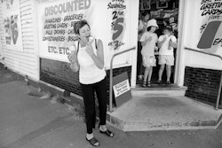 Look at that picture, the ice-cream was running all down my arm. It’s such a wee tiny postage-stamp corner of the world, isn’t it, but the thing is, that little shop means something to me. My grandparents lived just three doors along, in Abberley Crescent, and going to visit them was so amazing. This huge old villa with a big passageway up the middle and leadlight windows and such a wonderful garden. Every couple of years we would come up from the farm and stay in that house with them. My grandfather was an old Scotsman who’d fought in the Boer War. He was rather deaf, sometimes conveniently and sometimes not, and every day he would give us a penny, a copper penny, which seemed to fill the whole of my hand and he’d say, ‘Don’t you spend it all in the one shop.’ But we did, a halfpenny at a time. And that’s the thing, in our throw-away society where they like to bulldoze every little bit of history, the shop is still there. Every bit still the same. From the oiled floor boards to the wonderful wee corner step we used to sit on and which caught the morning sun so well. Just to know it’s there makes me feel warm inside. All those memories that still comfort me. It’s true, even today, if I’m feeling down I’ll go back and buy myself an ice-cream or a chocy bar and sit in the little park nearby to read or perhaps write a letter. So many crap things happen in the world and this place reminds me of the good. Something good from back there and it’s with us still.